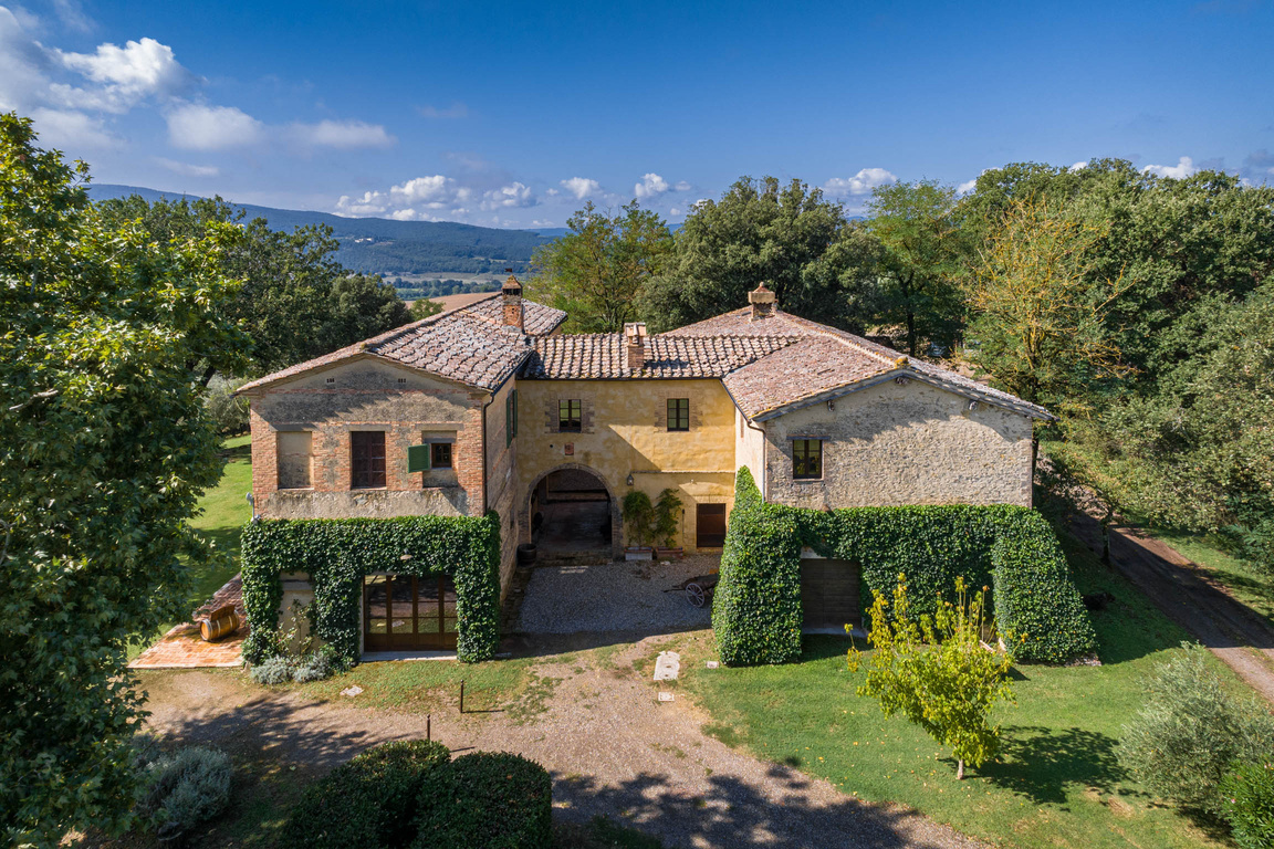 A stone retreat property surrounded by gardens and countryside